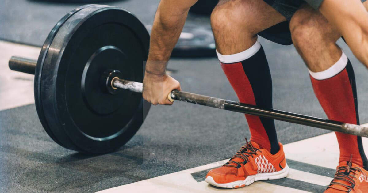 Weight lifting 3. Тяжелая атлетика stock photo. Фото спортсменов кто занимается резиновым бинтом.